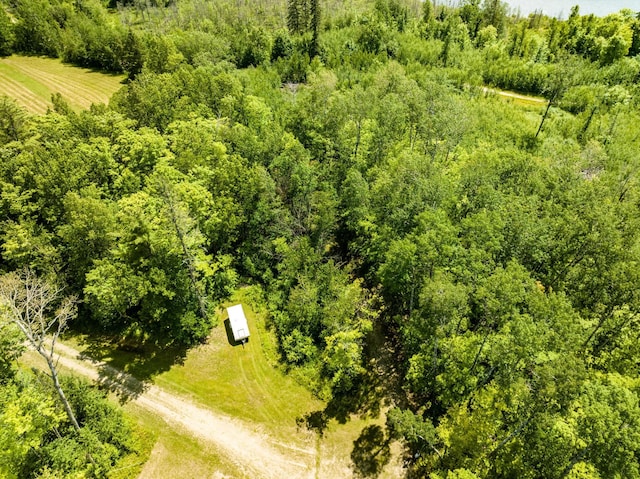 birds eye view of property with a rural view