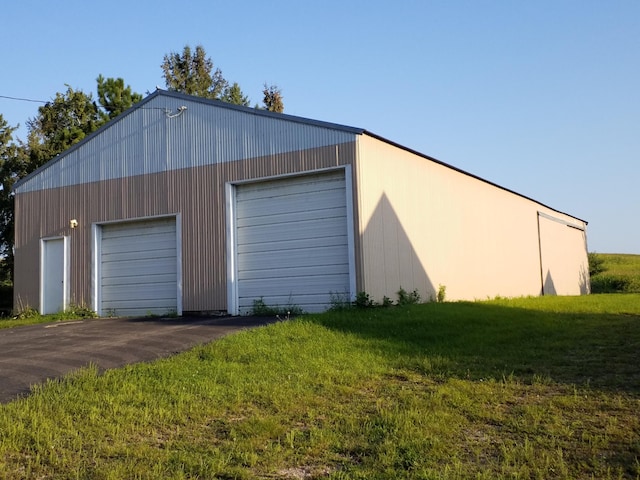 garage with a yard