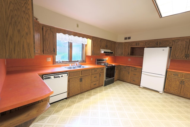 kitchen with sink, white appliances, and light tile patterned floors