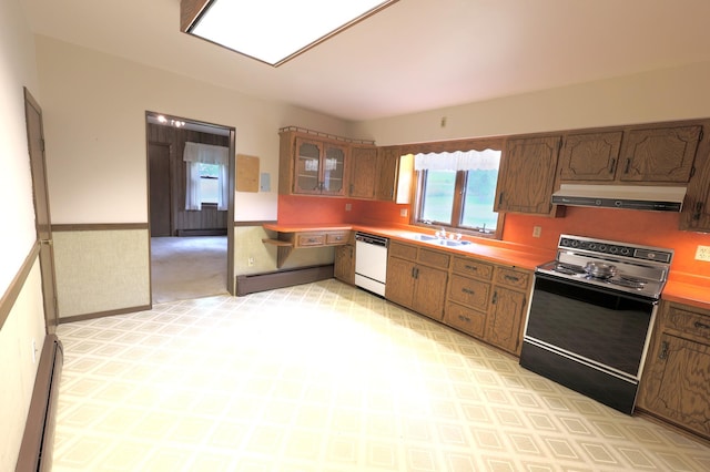 kitchen with baseboard heating, range with electric cooktop, light carpet, white dishwasher, and sink