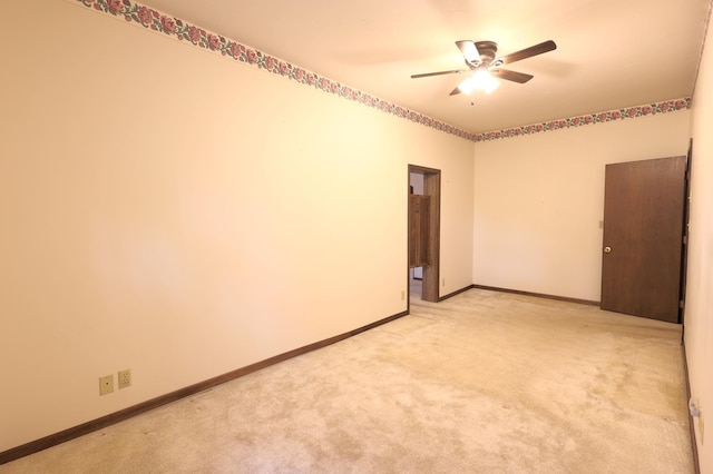 carpeted empty room with ceiling fan