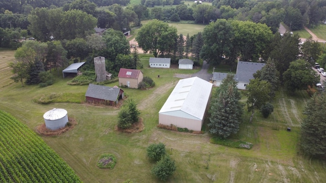 birds eye view of property with a rural view