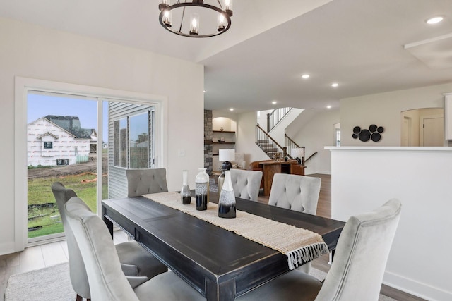 dining room featuring a notable chandelier and light hardwood / wood-style floors