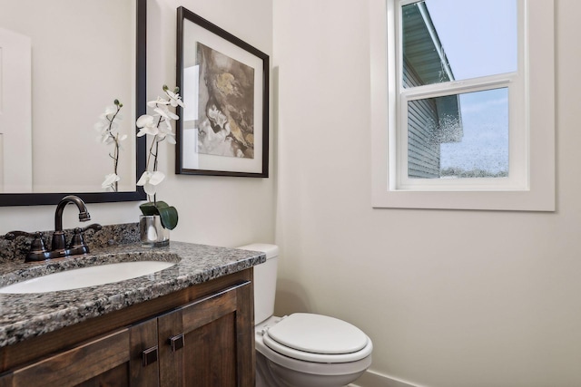 bathroom with toilet and vanity