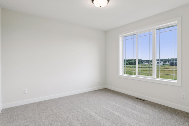 empty room featuring carpet floors