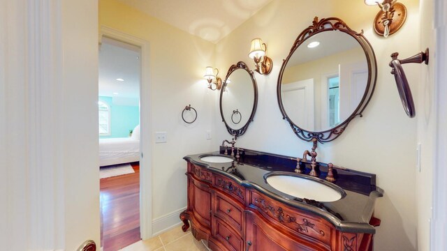 bathroom featuring vanity and hardwood / wood-style flooring