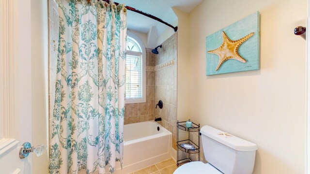 bathroom with toilet, tile patterned flooring, and shower / bathtub combination with curtain