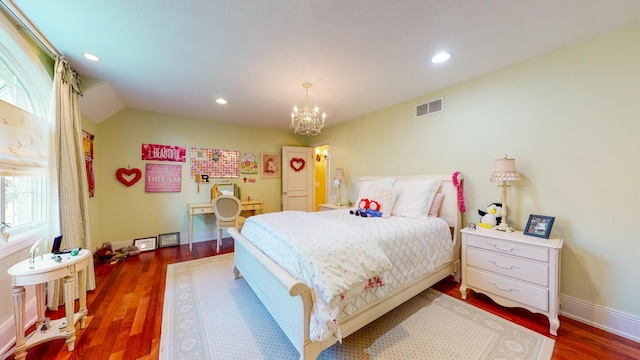 bedroom with dark wood-type flooring, lofted ceiling, and a notable chandelier