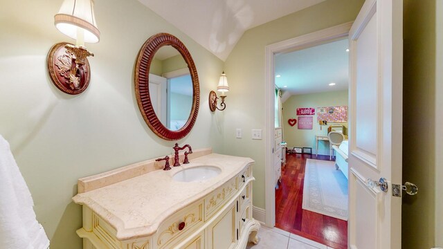 bathroom featuring vanity and hardwood / wood-style flooring