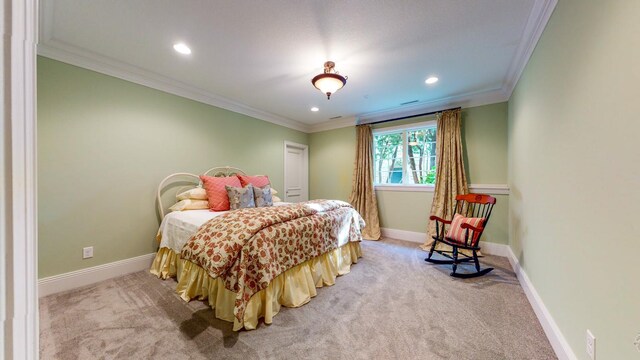 carpeted bedroom featuring ornamental molding