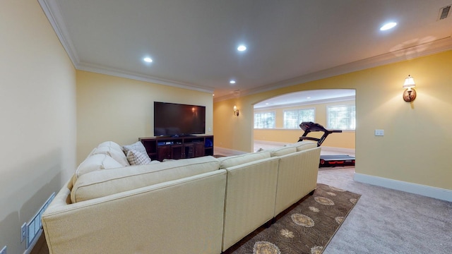 carpeted living room featuring ornamental molding