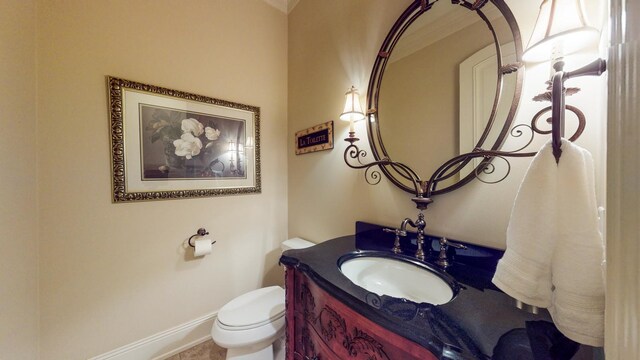 bathroom featuring toilet and vanity