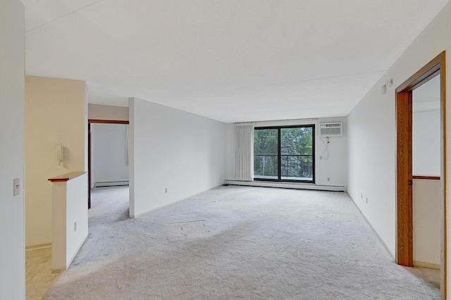 carpeted empty room with a baseboard radiator and an AC wall unit