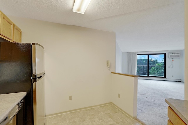 kitchen with light carpet, stainless steel refrigerator, a textured ceiling, light brown cabinetry, and a baseboard heating unit