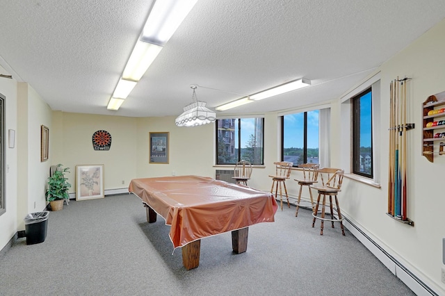 recreation room with carpet flooring, pool table, a baseboard radiator, and a textured ceiling