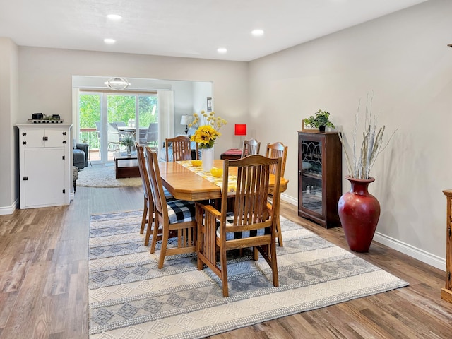 dining room with hardwood / wood-style floors