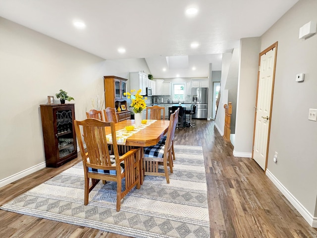 dining area featuring hardwood / wood-style floors