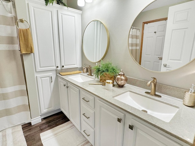 bathroom featuring vanity and wood-type flooring