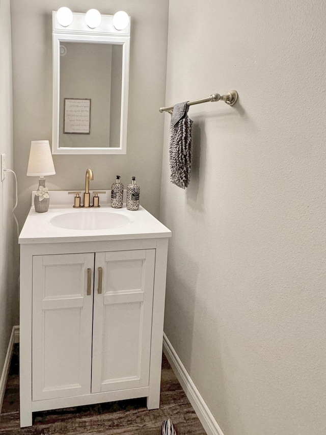 bathroom with vanity and wood-type flooring