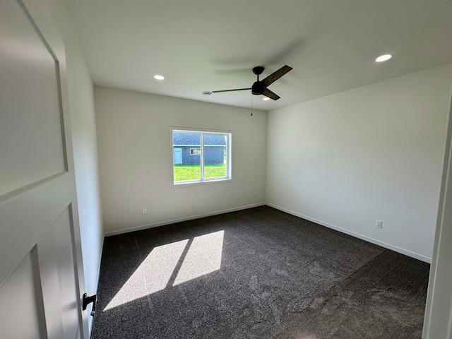 unfurnished room with dark carpet, baseboards, a ceiling fan, and recessed lighting