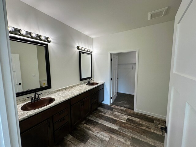 bathroom with vanity and hardwood / wood-style floors