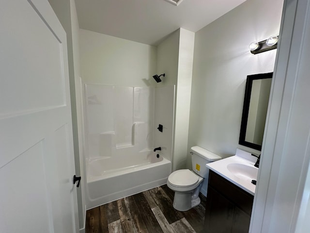 full bathroom featuring vanity, toilet, hardwood / wood-style flooring, and bathtub / shower combination