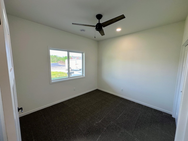 unfurnished room with dark colored carpet, baseboards, a ceiling fan, and recessed lighting