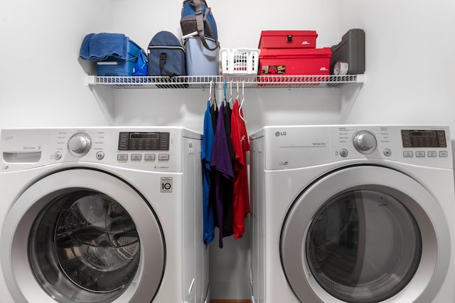 laundry area with independent washer and dryer