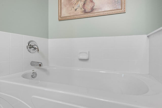 bathroom featuring a washtub