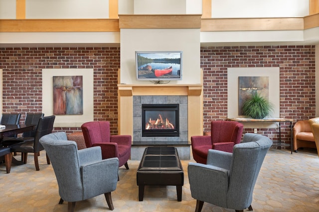 interior space featuring a tile fireplace and brick wall