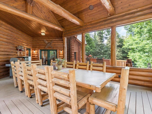 interior space with rustic walls, wood ceiling, beam ceiling, and light hardwood / wood-style floors