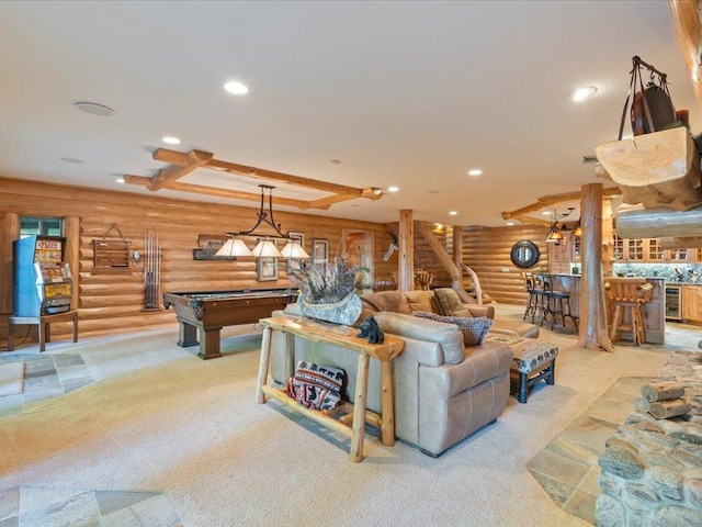 living room with billiards, beamed ceiling, log walls, beverage cooler, and light carpet