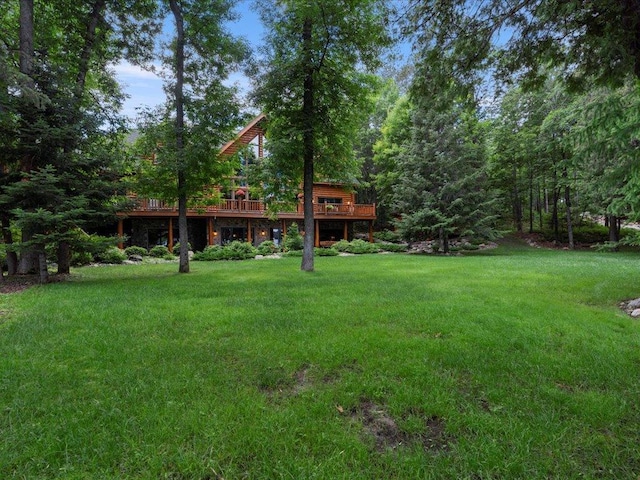 view of yard with a wooden deck