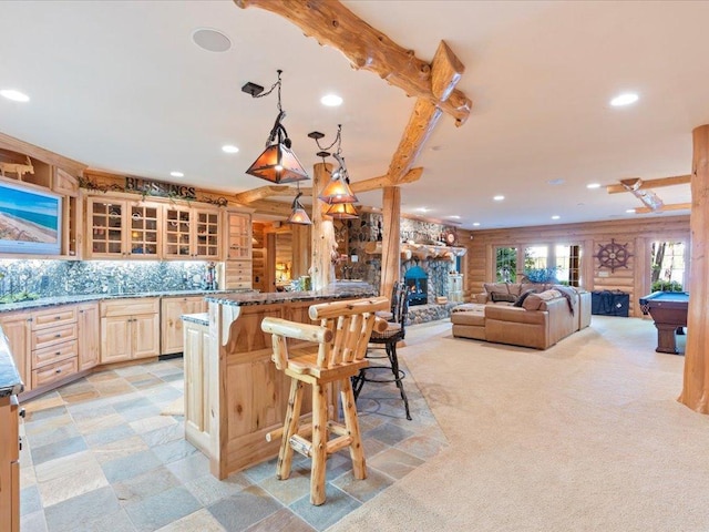 kitchen featuring billiards, log walls, a kitchen bar, decorative backsplash, and hanging light fixtures