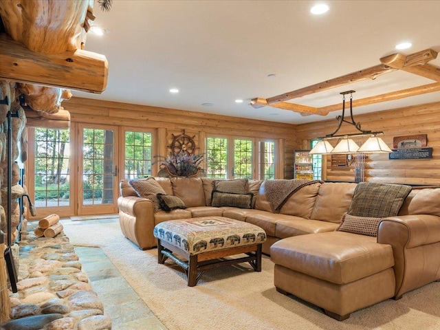 carpeted living room featuring beamed ceiling and log walls