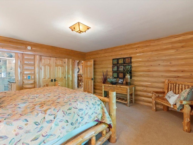 carpeted bedroom featuring rustic walls