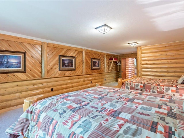 carpeted bedroom featuring rustic walls