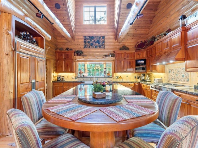 dining area featuring wood ceiling, beam ceiling, and high vaulted ceiling