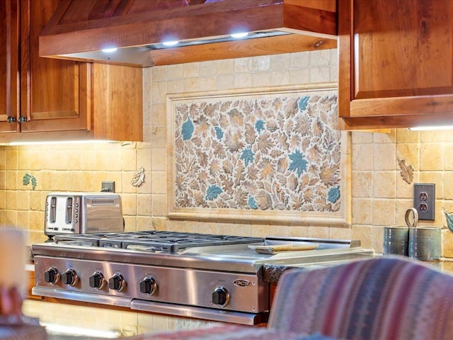 kitchen with tasteful backsplash and wall chimney exhaust hood