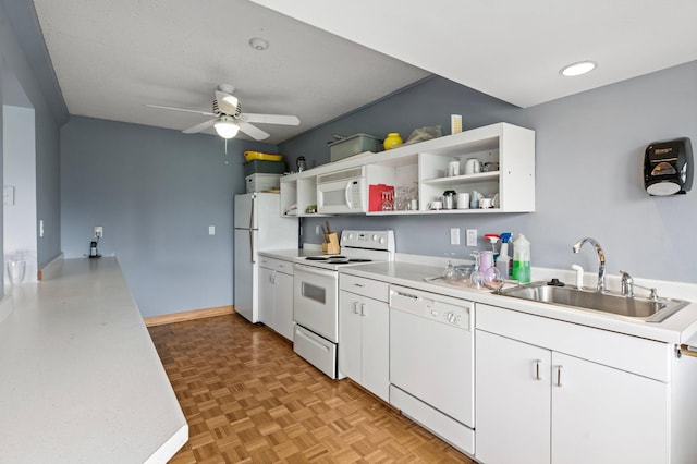 kitchen with white appliances, light countertops, white cabinetry, open shelves, and a sink