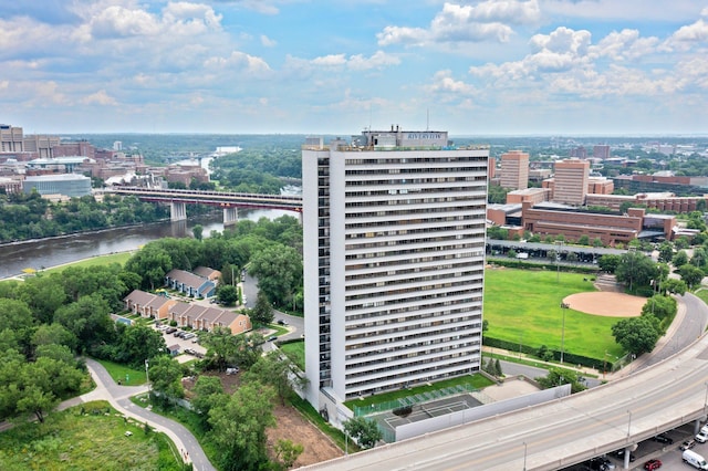 drone / aerial view featuring a water view and a view of city