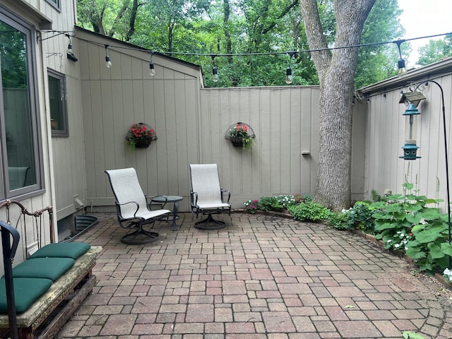 view of patio / terrace featuring fence