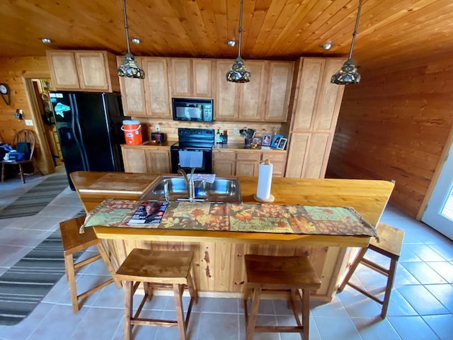 dining area with wood walls, sink, light tile patterned floors, and wood ceiling