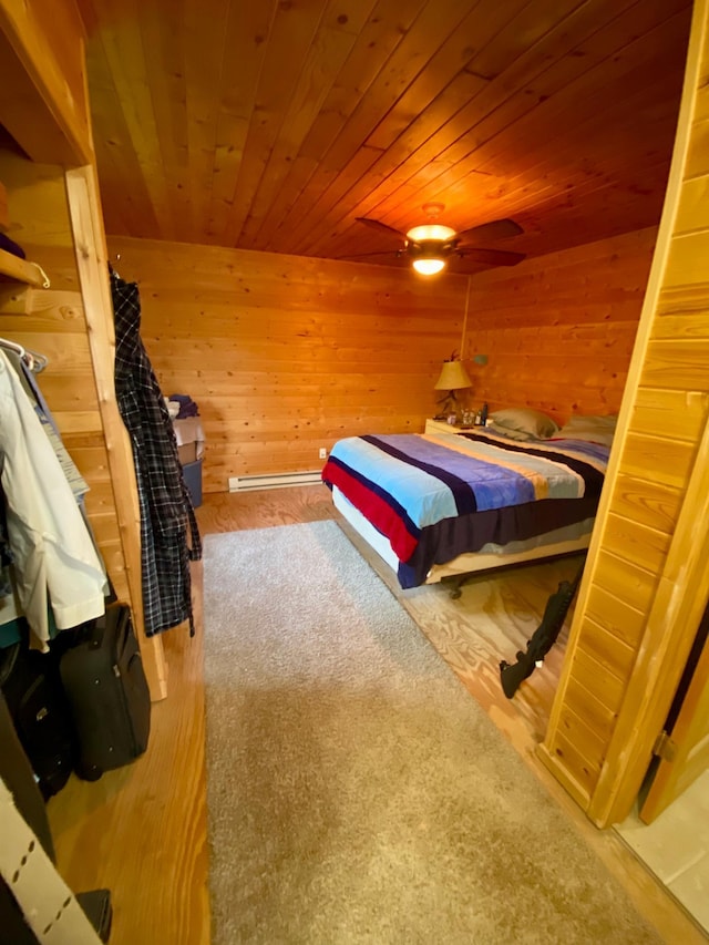 bedroom with wooden ceiling and wooden walls