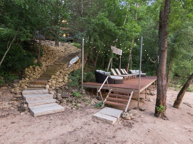 view of yard with an outdoor living space and a deck