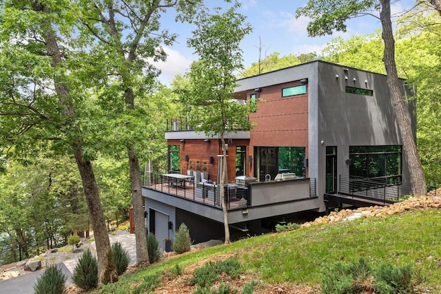 rear view of house with a garage