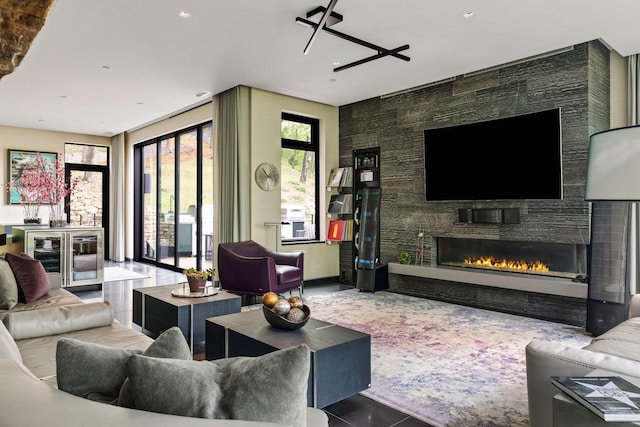 tiled living room with a stone fireplace and beverage cooler