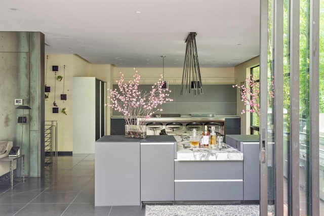 kitchen featuring dark tile patterned flooring