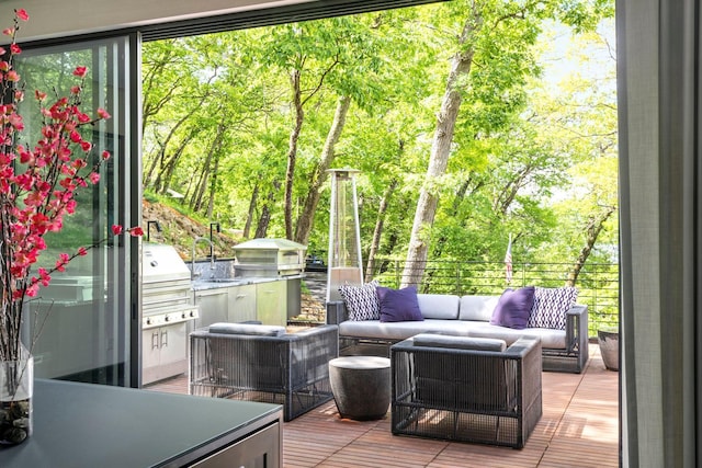 wooden terrace featuring exterior kitchen