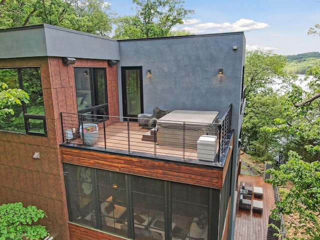 rear view of house featuring a balcony